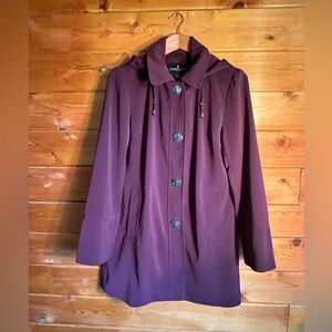 London Fog rain coat - burgundy, shiny silver hardware, pockets, and hood.